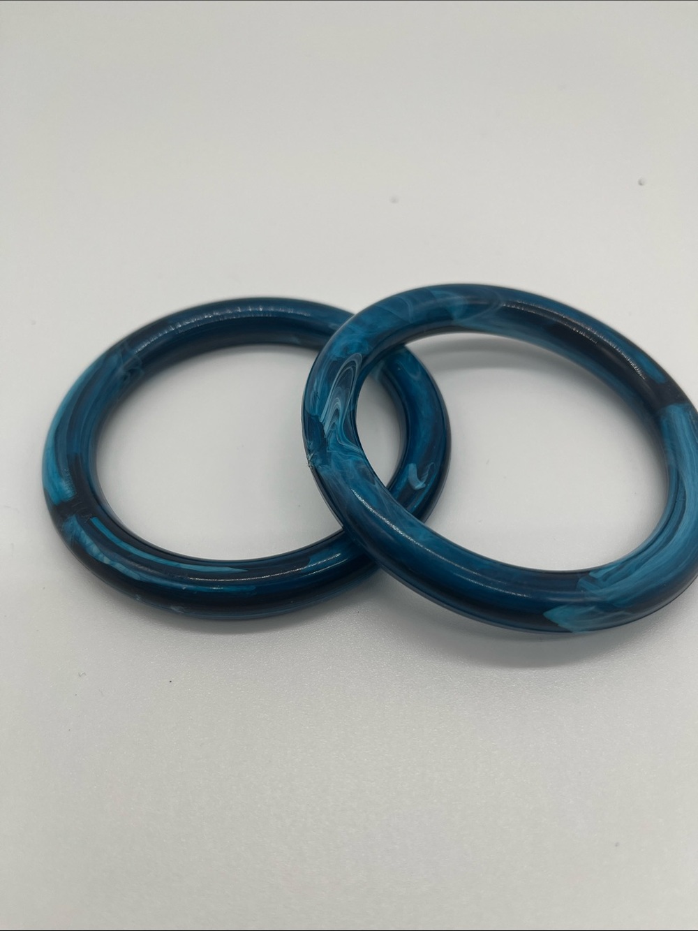 Marbella blue marbled plastic bangle bracelets. Quantity of 2 bracelets.